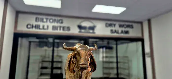 Danie Jooste Butchery bull statue and interior signage