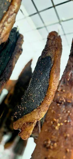 Traditional beef biltong hanging in curing room